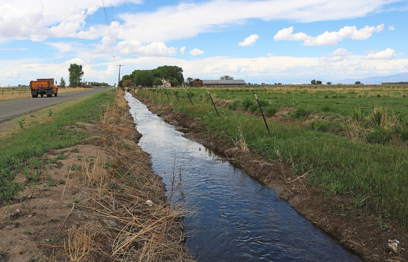 Acequia irrigation ditch north of Sanford, Colorado, carrying water through agricultural land